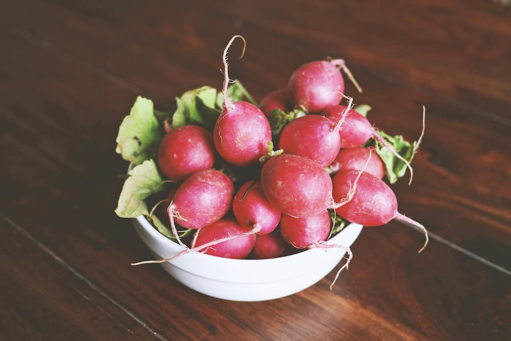 Radishes in a white bowl