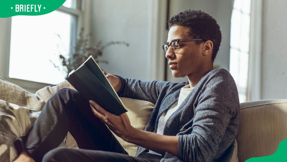 A young man reading a book