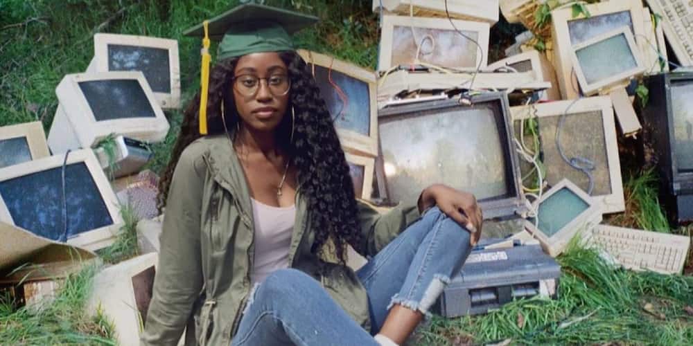 So cute: Huge reactions as lady shares adorable graduation photo of herself posing in front of many computers