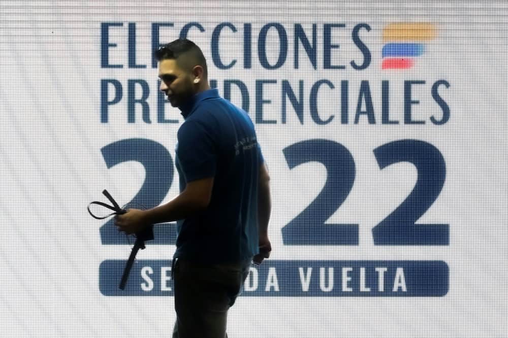 A man works at a polling station in Bogota, on June 18, 2022, a day before the presidential runoff election