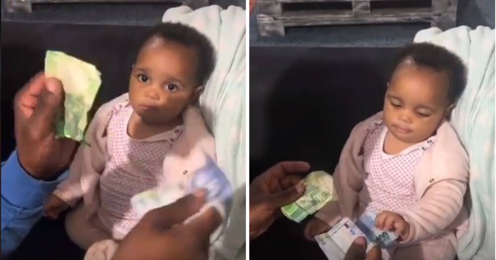 An adorable toddler chose an R100 note in a game of choice.