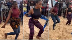 Barefooted ladies in skintight outfit show off stellar dance moves; man removes wrapper on one in video