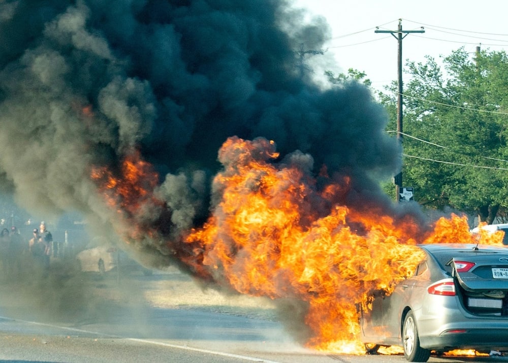 A Ford Fusion hybrid vehicle burns near Austin, Texas, on June 25, 2022