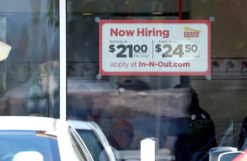 The US unemployment rate edged down in November while wage growth accelerated from a month prior, government figures showed