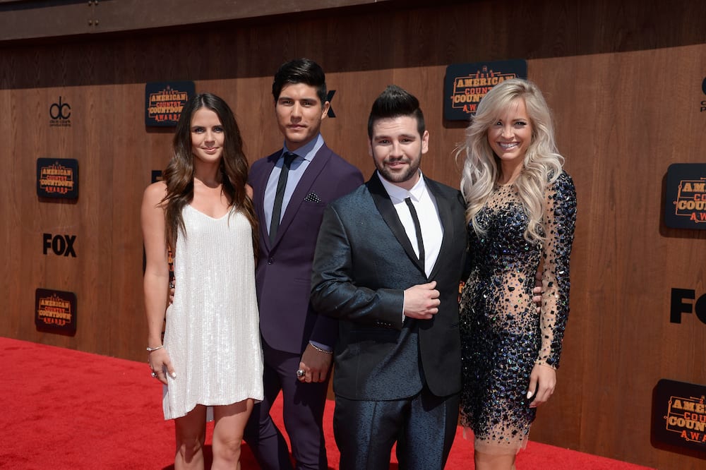 Dan and Shay with their wives at the American Country Countdown Awards