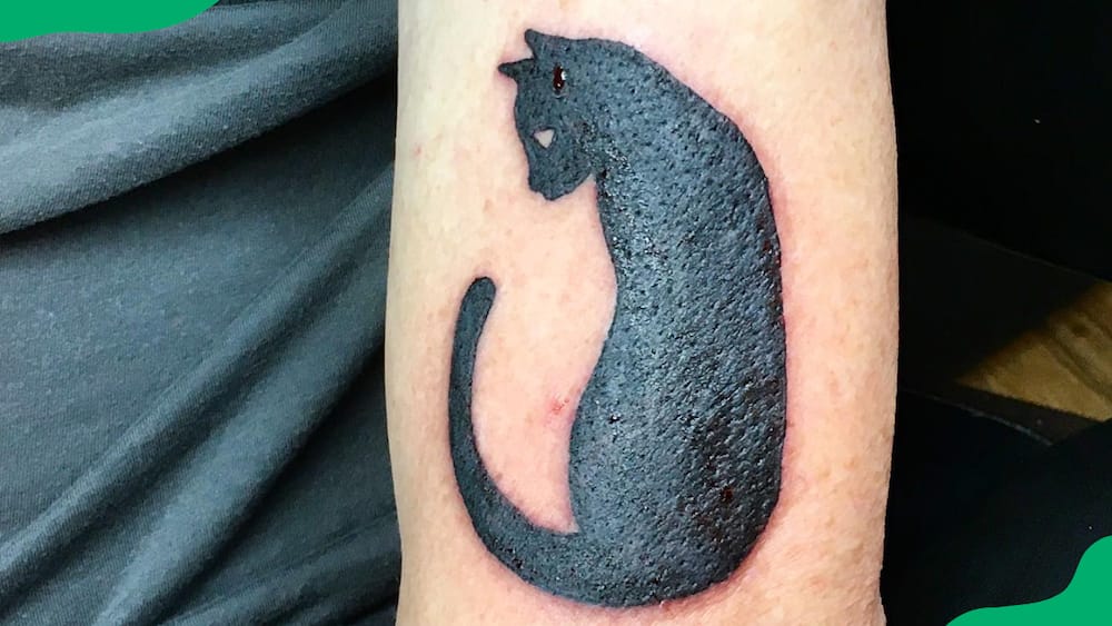 Cat silhouette tattoo