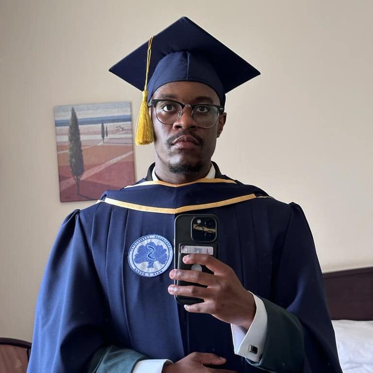 A man graduated with two degrees from a Russian university