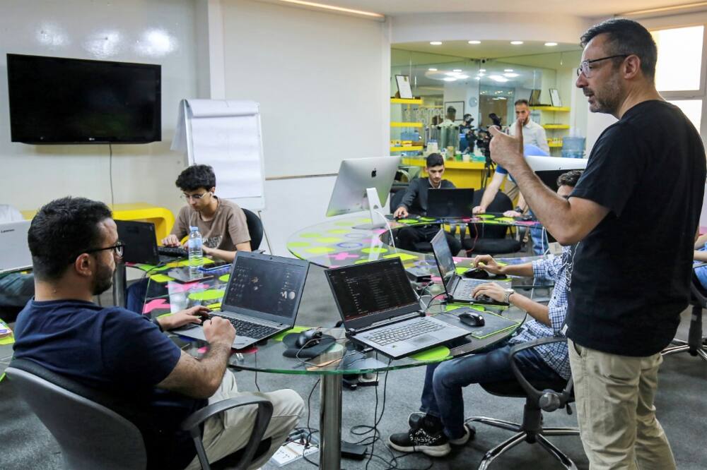Nour Khrais, technical partner in The Jordan Gaming Lab, which provides equipment and educational courses to young people on all aspects of the gaming industry, talks to his team at their office in Amman