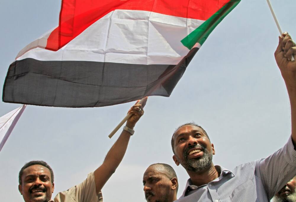 Former minister Khaled Omar Youssef (right) during an anti-coup demonstration in southern Khartoum on July 26, 2022