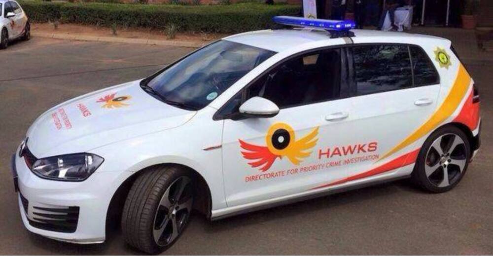 Two men arrested pretending to be Hawks trying to scam a business owner.