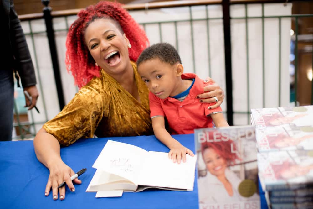 how old are Kim Fields’ sons