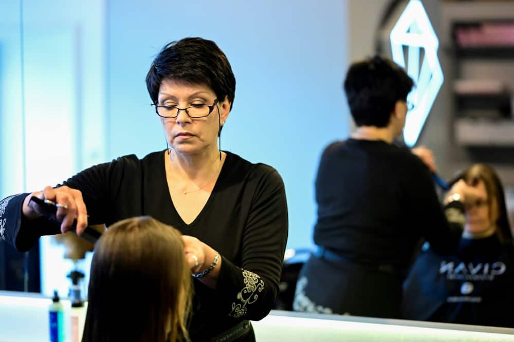 Ukrainian hairdresser Valentyna Vysotska is employed in Berlin after a 10-month crash course to learn German