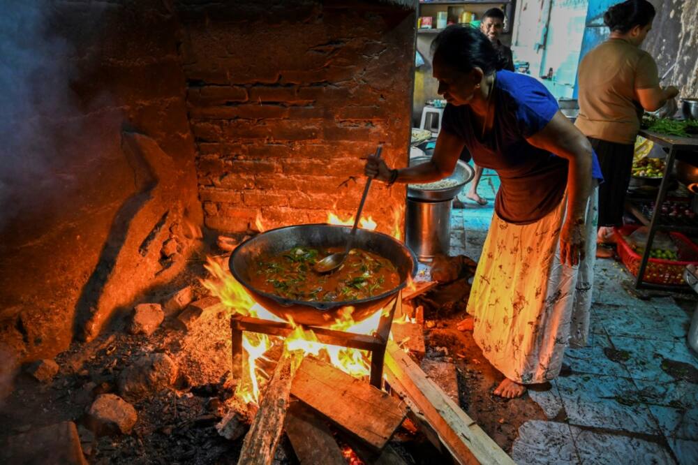 With gas prices soaring in the struggling nation, many Sri Lankans have been forced to revert to cooking with firewood