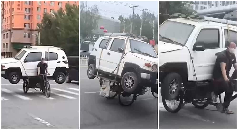 Chinese man uses bike to carry a car in video.