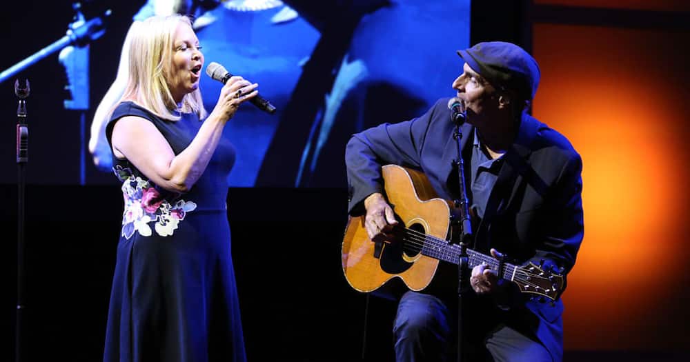 How old is James Taylor's wife?