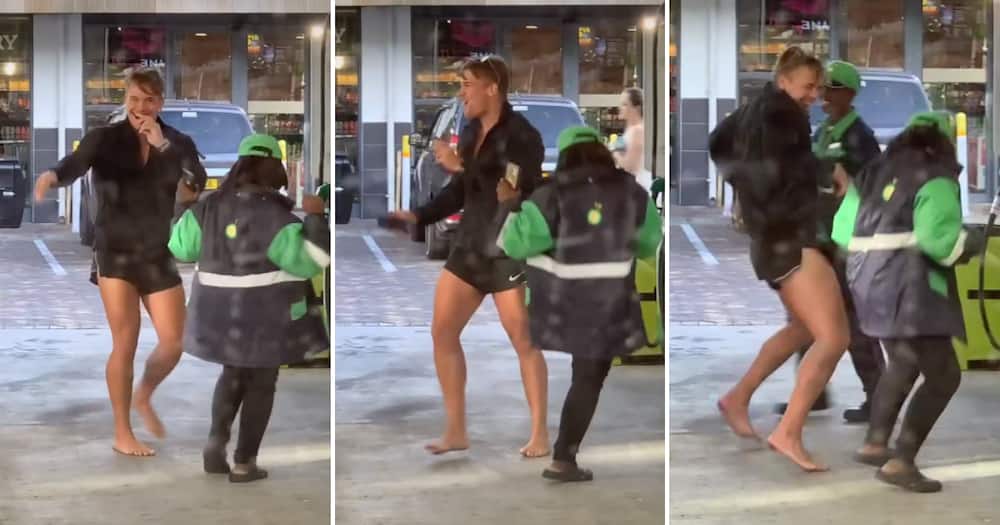 Man and petrol attendant dancing