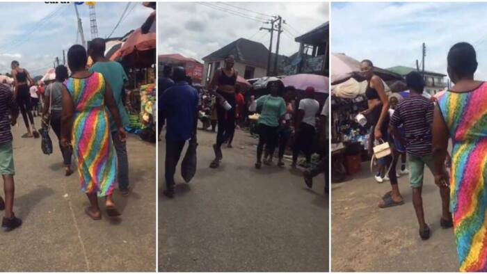 Clip of super tall woman spotted in Nigerian market stuns people: "Cameraman scared to record"