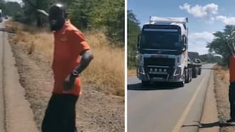'Truckspotting' is real! Watch a Zambian dance in delight as gleaming Volvo truck driver toots horn and flashes lights