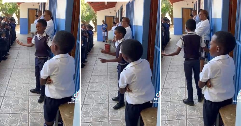 A boy praying at school assembly