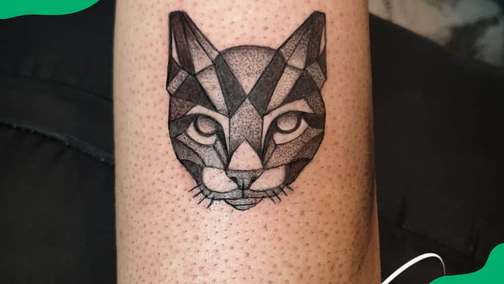 Geometric cat face tattoo
