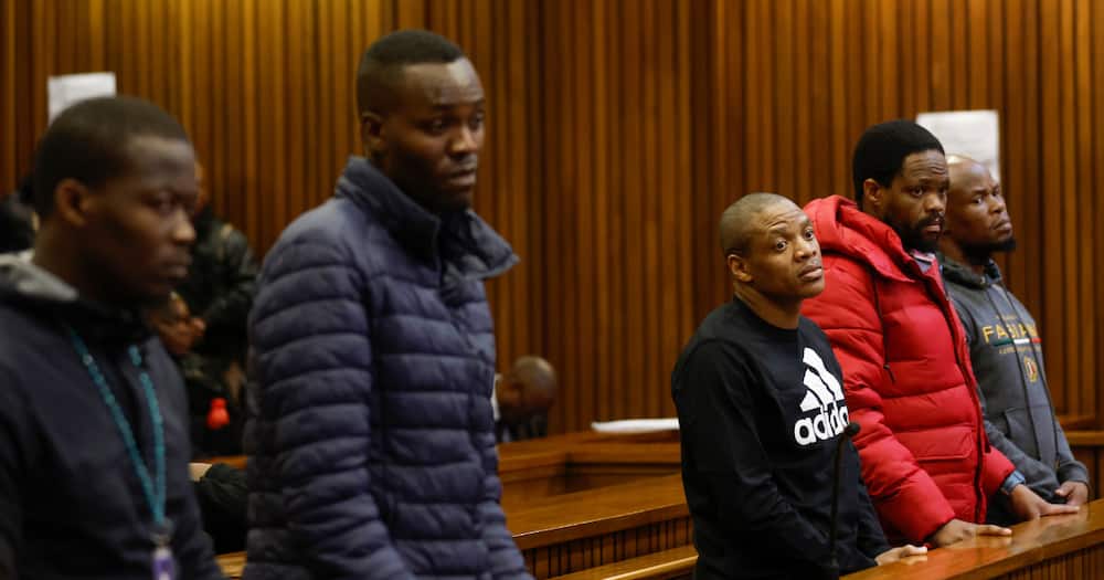 Five accused men in the Senzo Mayiwa murder trial stand in the dock at Pretoria High Court