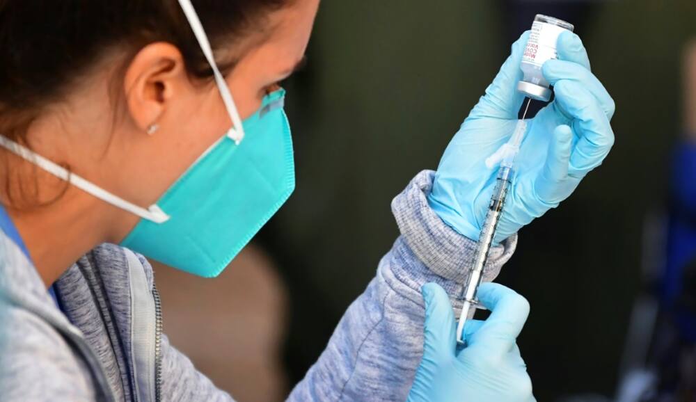 In this file photo from 2021 the Moderna Covid-19 vaccine is loaded into a syringe ahead of an injection