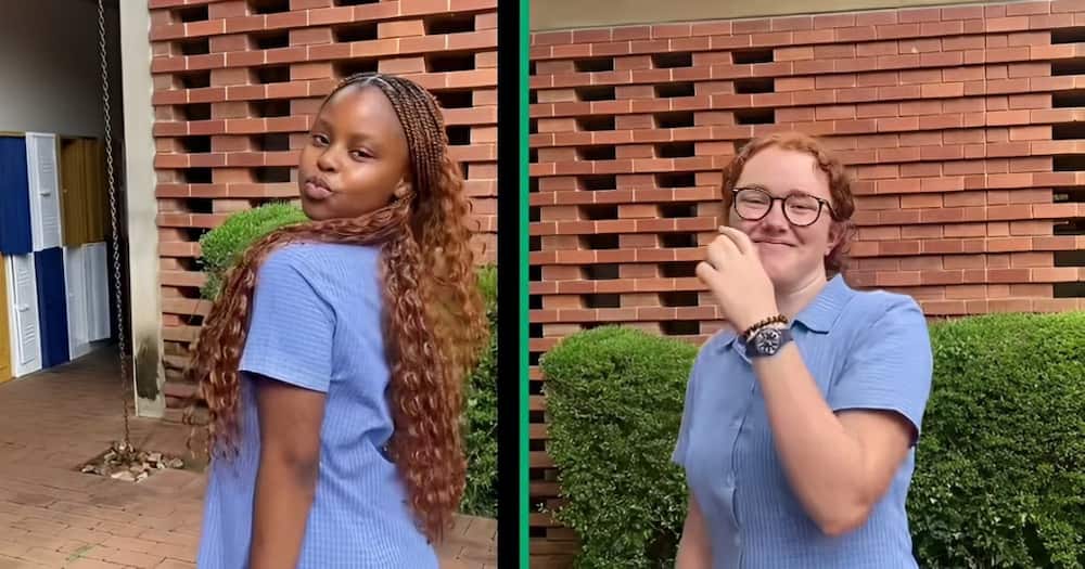 Two school pupils unveiling their matching hairstyles in a TikTok video.
