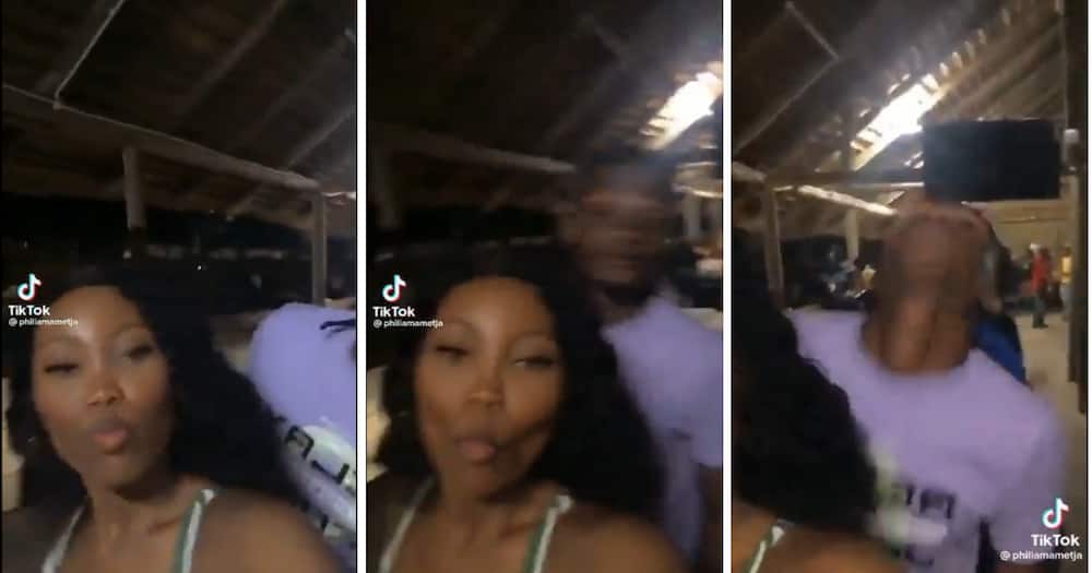 A dude got pulled aside by his bae while dancing behind another woman and groove.