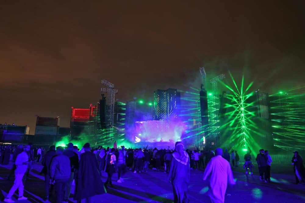 People attend the Soundstorm music festival, organized by MDLBEAST, in Banban on the outskirts of the Saudi capital Riyadh on December 16, 2021