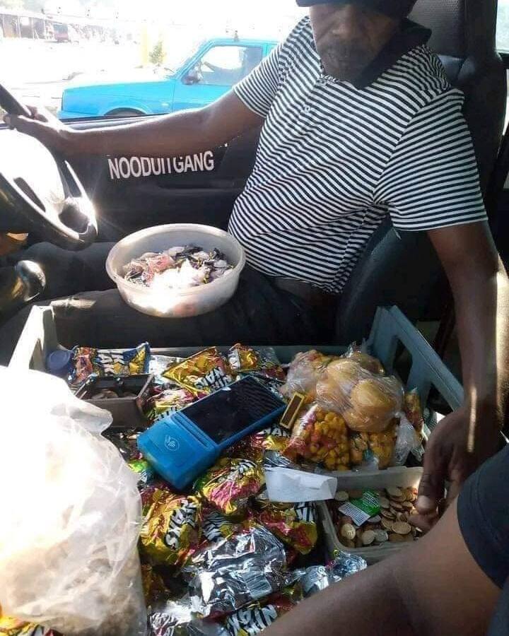 A Taxi driver opened a tuckshop in his vehicle.