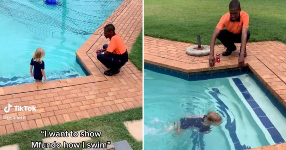 Durban toddler Pey shows courier driver Mfundo her swimming