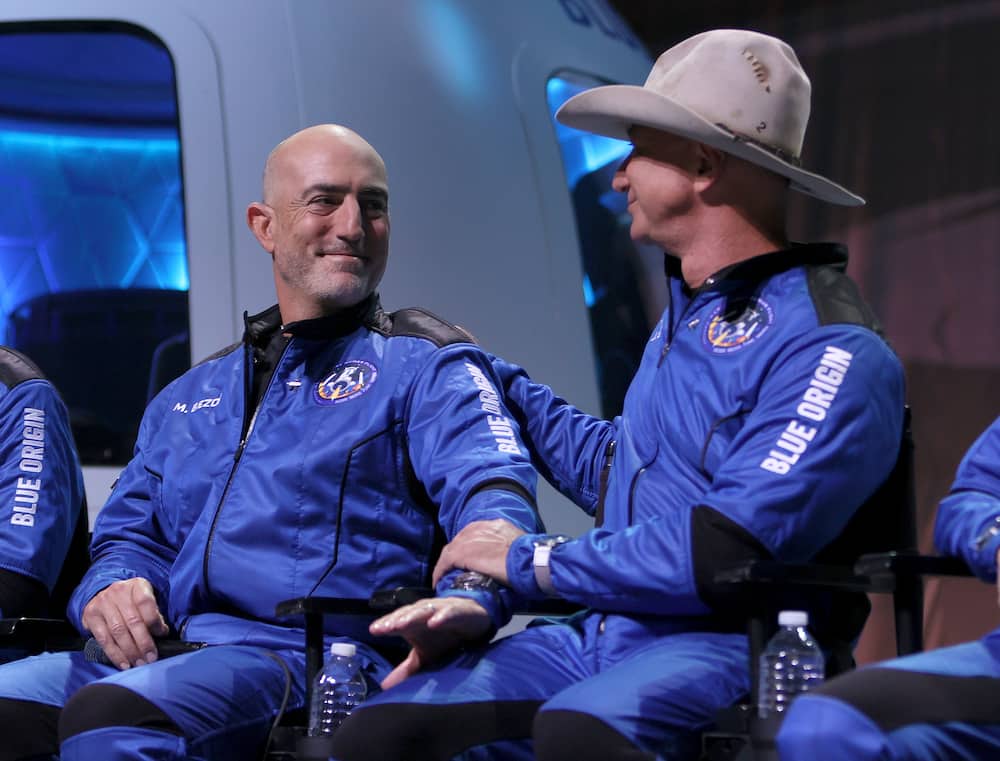 Mark Bezos and his brother Jeff during a press conference after flying into space in the Blue Origin New Shepard on 20 July 2021 in Van Horn, Texas.