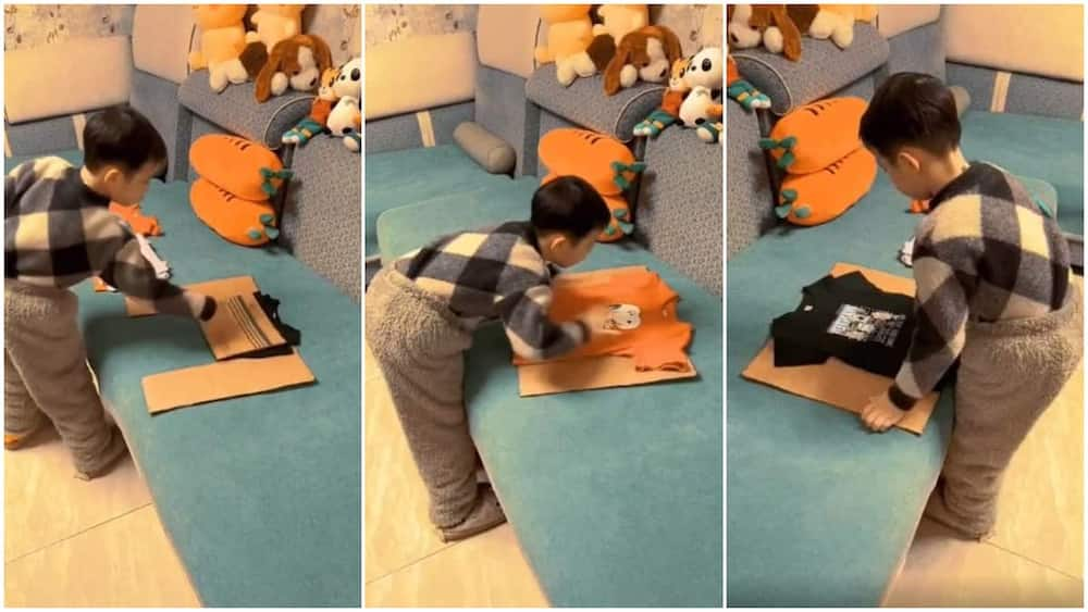 kids folding clothes with cardboard        <h3 class=