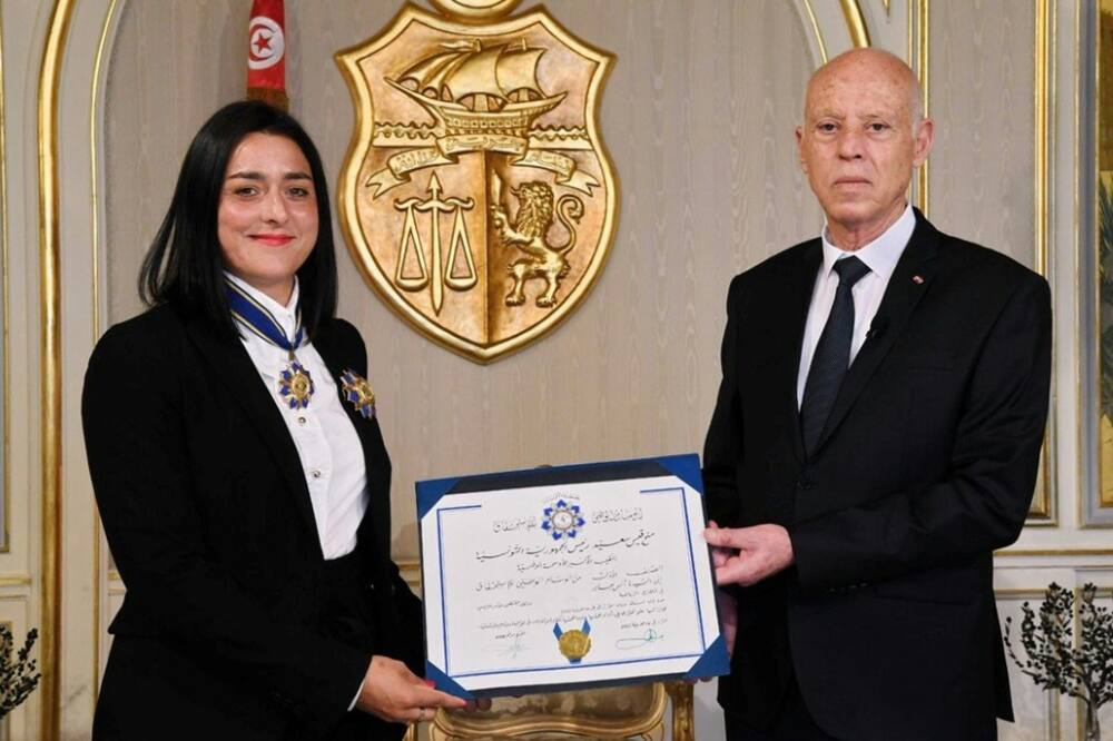 Star treatment: A handout picture shows Tunisian President Kais Saied presenting Ons Jabeur with the Order of Sports Merit award