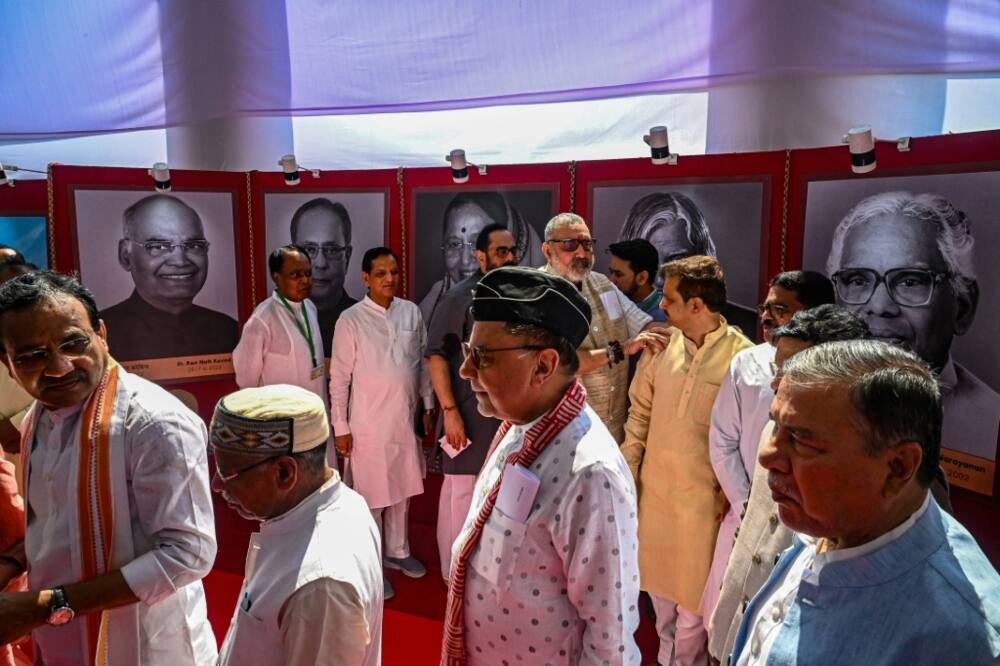 Members of India's parliament queue to vote for the country's next president on Monday