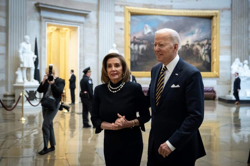 House Speaker Nancy Pelosi, who is considering a Taiwan visit that has caused unease in the administration, walks with President Joe Biden in the US Capitol in March 2022