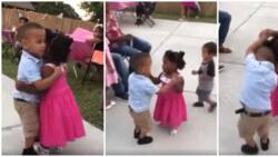 "So adorable": Little girl and boy hold hands and hug tightly as they share cute dance together