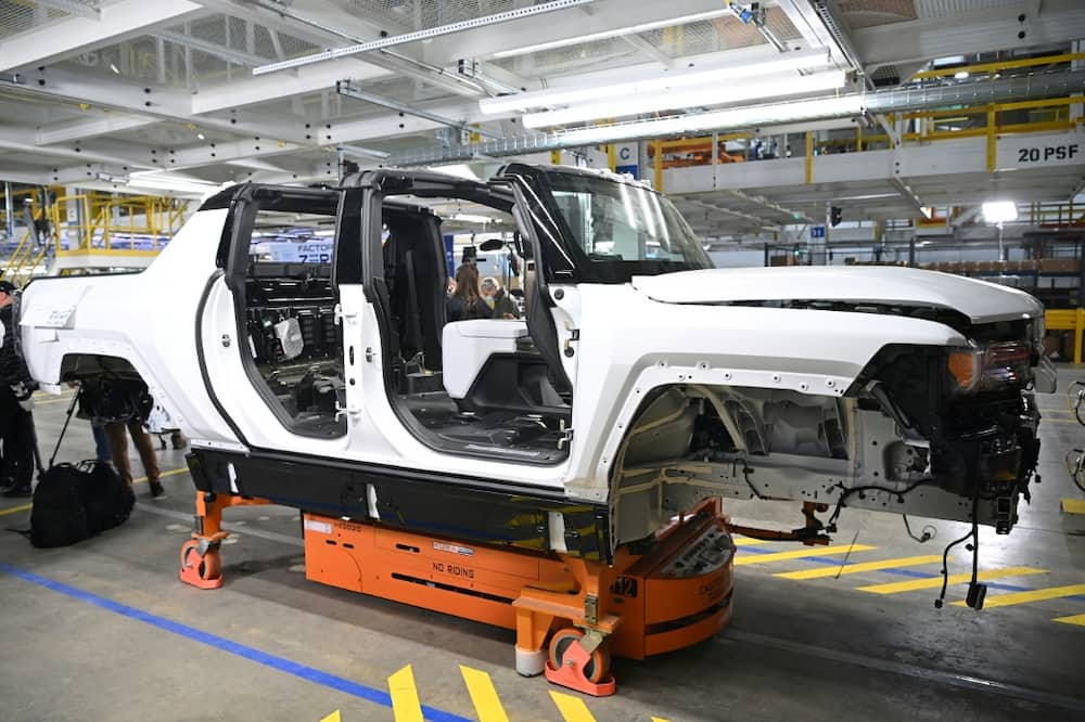 A GMC Hummer EV seen on an assembly line in Michigan is part of the new electric fleet being developed by General Motors, which reported lower profits due to the semiconductor shortage